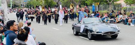 Hugh Nguyen participating in the Garden Grove Strawberry Festival parade.